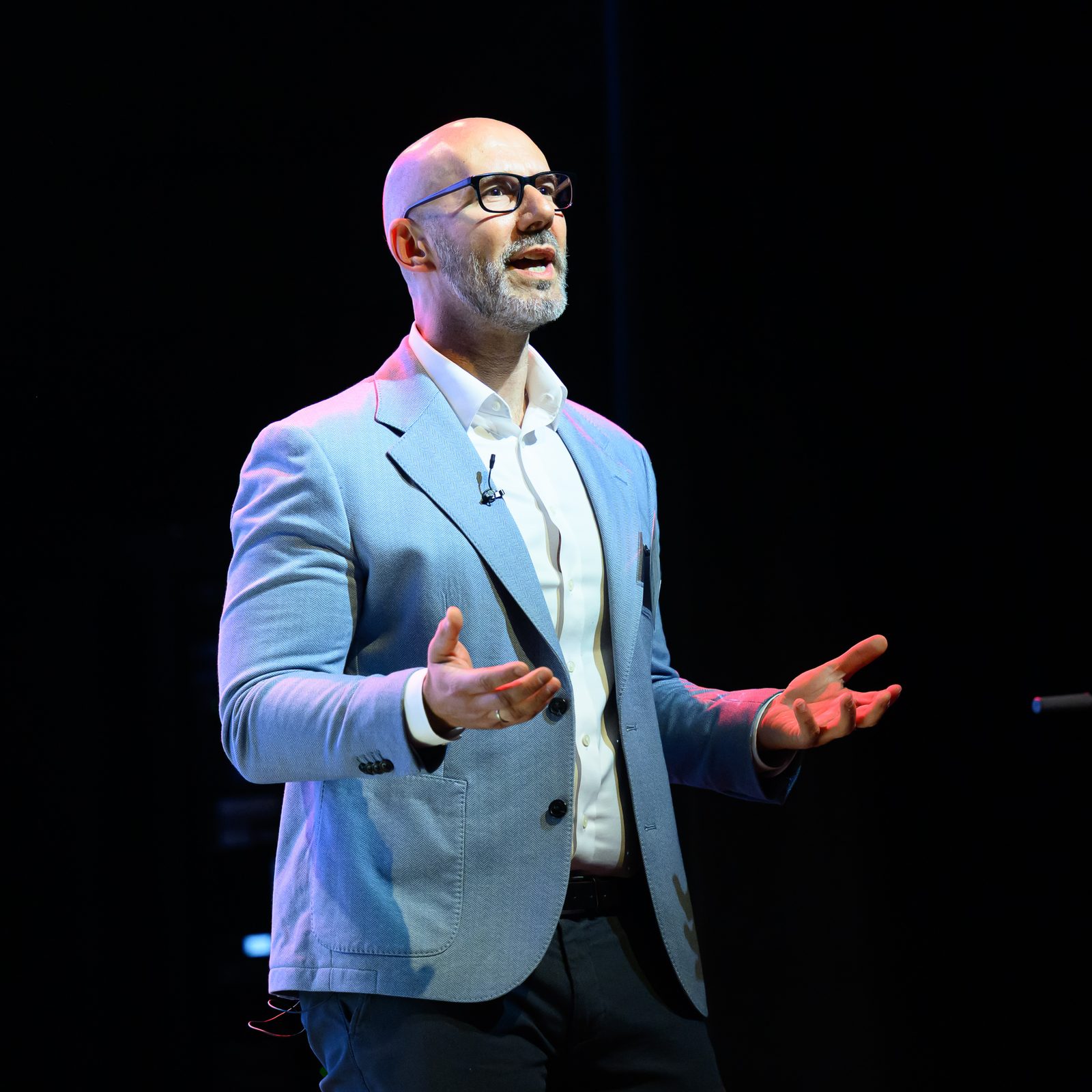 Dr Pedja Stojicic speaking on stage at an annual meeting
